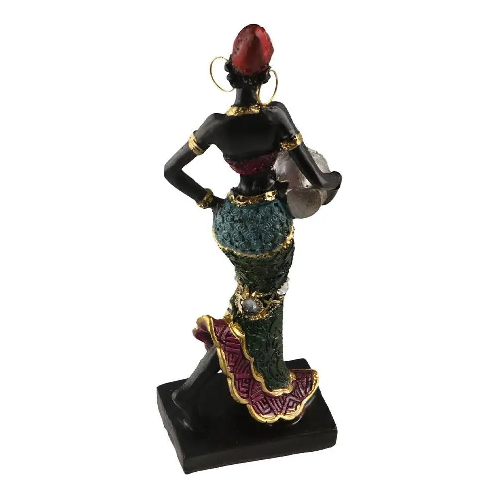 Hand-painted resin statue of an African tribal lady with a red headdress and jewelry.