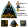 A triangular pyramid crystal display featuring obsidian, gold foil, and a copper screw.