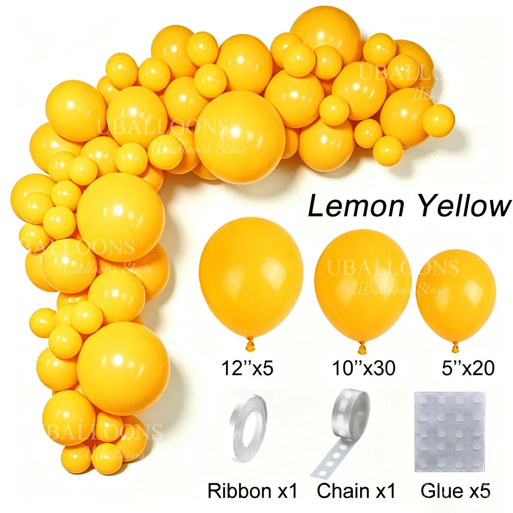 A collection of lemon yellow latex balloons and accessories including ribbon, chain, and glue for party decor.