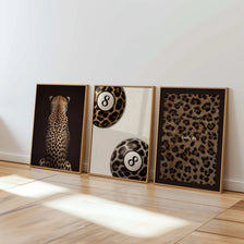 A set of three framed art prints featuring leopard print and black-white designs on a white background.
