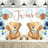 A photo backdrop featuring two cute cartoon teddy bears and blue balloons with floral accents for a baby shower.