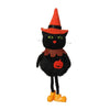 A black cat ornament with an orange witch hat and striped collar, standing on yellow feet.