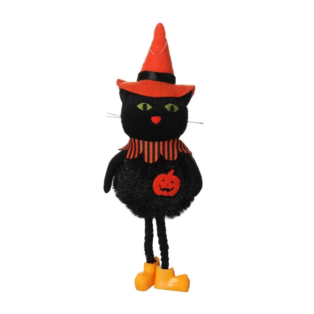 A black cat ornament with an orange witch hat and striped collar, standing on yellow feet.