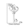 A silver antique cross charm with a loop and a small ball, measuring 33mm long and weighing 2.0g.