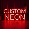 A bright red neon sign spelling out CUSTOM NEON is displayed on a dark wooden floor.