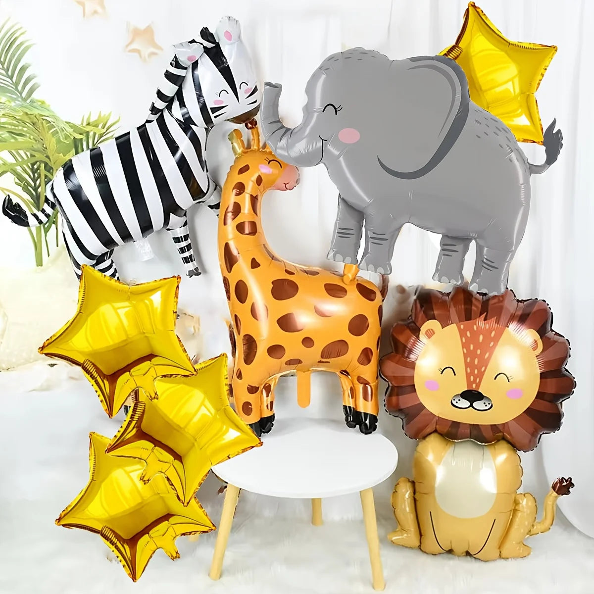 A set of eight foil balloons depicting jungle safari animals including a zebra, elephant, giraffe, and lion.