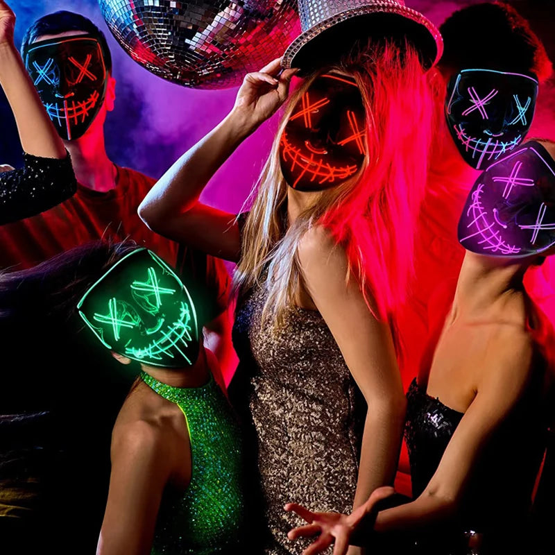 A group of people wearing glowing LED Halloween masks with various light modes against a red background.