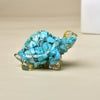 Durchsichtige blaue Kristall-Schildkrötenfigur mit strukturierten Schuppen und goldenen Akzenten.