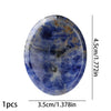 A smooth, oval-shaped natural blue stone bead with varying shades of blue and brown inclusions.
