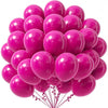 A bunch of assorted bright pink latex party balloons tied together with strings.