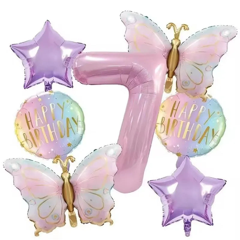 A set of seven pink butterfly number balloons shaped like the number seven for a birthday party decor set.