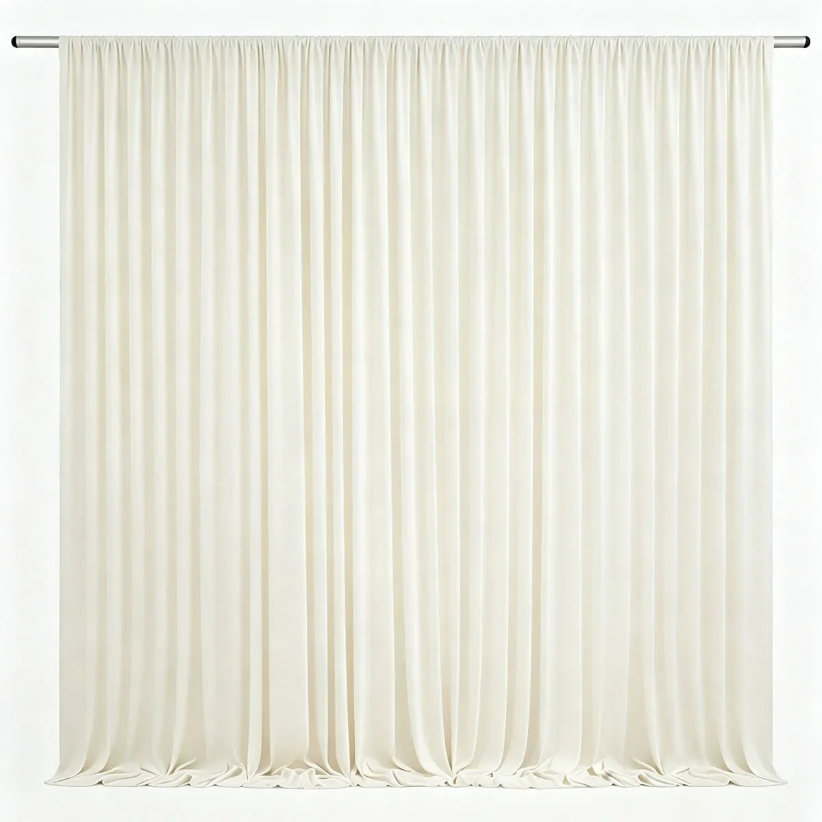 Cream colored pleated drapery backdrop hanging from a rod