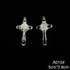 A pair of silver crucifix pendants featuring an enamel finish.