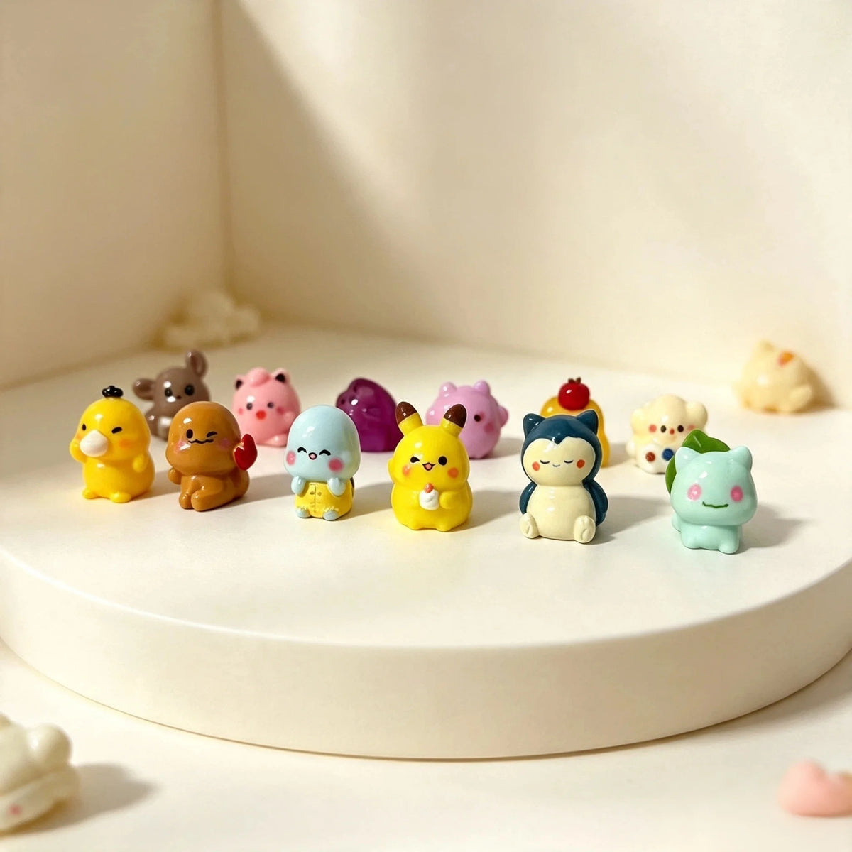 A collection of six colorful kawaii anime fantasy creature mini figurines arranged on a white surface.