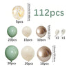 A collection of sage green and gold balloons in various sizes and finishes, including clear, matte, and metallic shades.