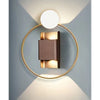 Modern geometric wall art featuring a circular light fixture with a gold ring and a rectangular light panel.