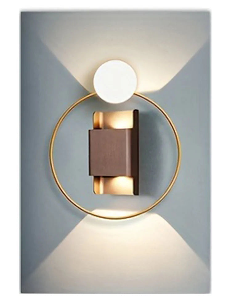 Modern geometric wall art featuring a circular light fixture with a gold ring and a rectangular light panel.