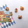 A set of adorable guinea pig refrigerator magnets featuring various brown and orange-colored animals.