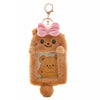 A fluffy brown bear keychain featuring a pink bow and an inset photo of another bear.