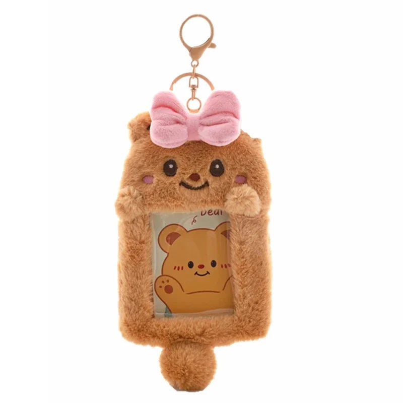 A fluffy brown bear keychain featuring a pink bow and an inset photo of another bear.