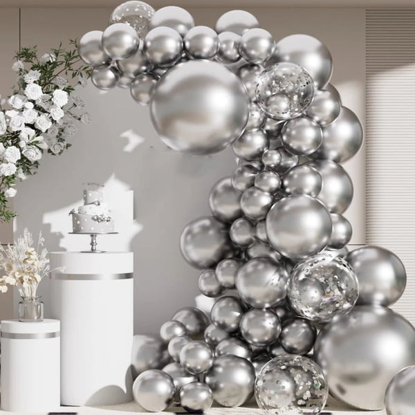 A metallic silver balloon garland arch decorated with confetti accents against a light background.