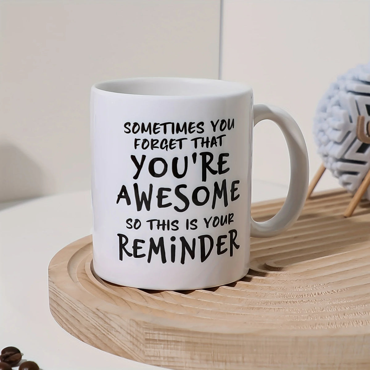 A white ceramic coffee mug with black text that reads Sometimes you forget that you're awesome so this is your reminder.