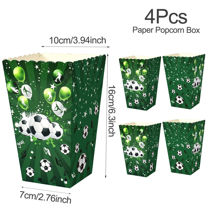 A box of four paper popcorn bags decorated with soccer themes and green confetti.