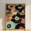 A framed canvas art print featuring a collection of vintage vinyl records in various colors and black.