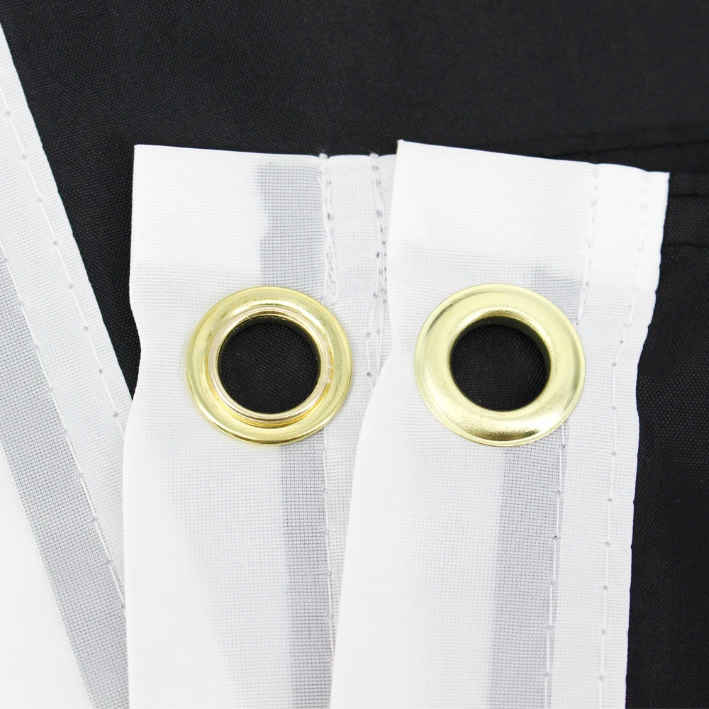 White outdoor polyester flag with gold grommets attached to a black fabric background
