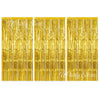 Three panels of shimmering gold metallic foil fringe curtains for party backdrop decor