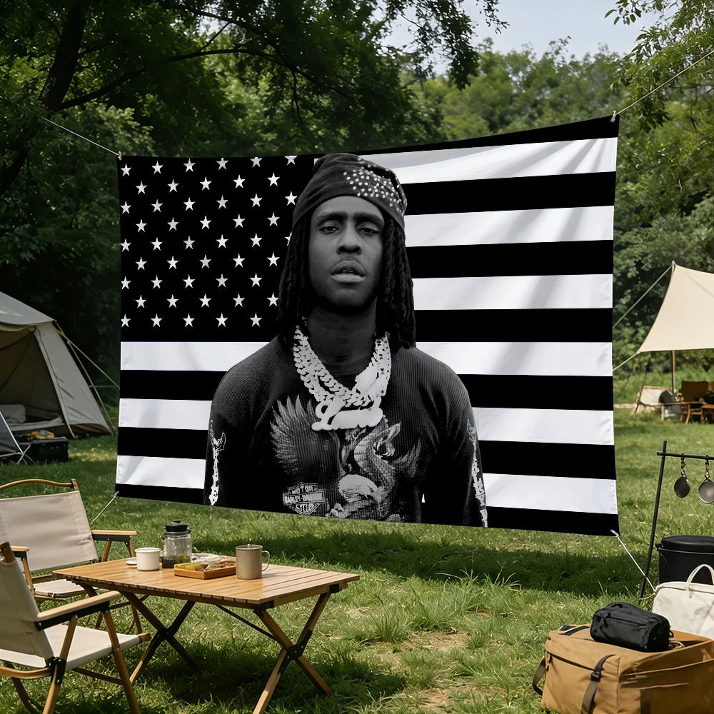 A black and white banner featuring a portrait of a man with dreadlocks against an American flag background.