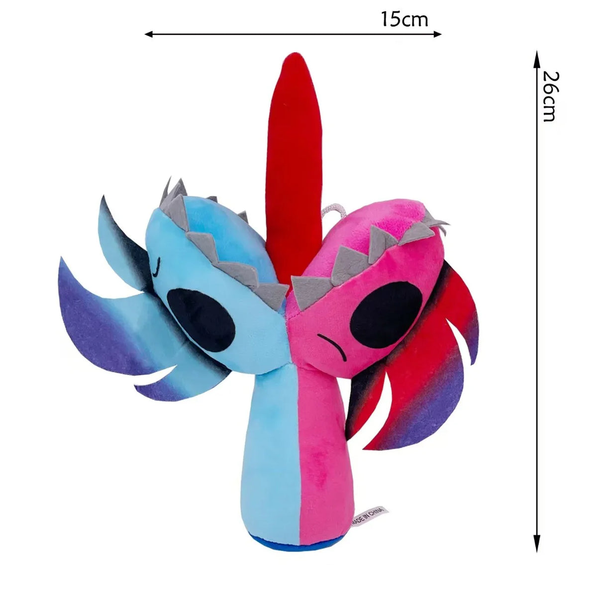 A plush toy set featuring a stylized character with pink and blue hair accents.