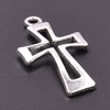 A silver antique cross charm with a bail, displayed on a dark gray background.