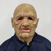 A realistic latex mask of an old man with wrinkled skin and a long neck, worn by a person in a dark blue shirt.