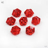 A collection of twelve faceted, deep red crystal ice cube acrylic stones arranged on a white background.