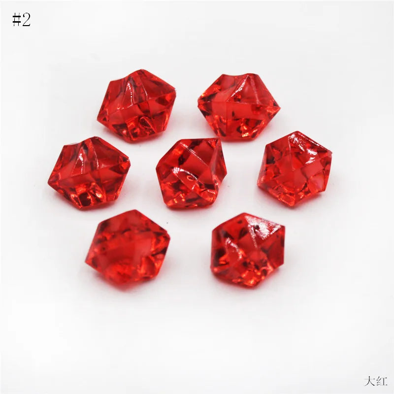 A collection of twelve faceted, deep red crystal ice cube acrylic stones arranged on a white background.