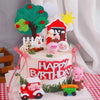 A tiered cake decorated with farm animal toppers including a tree, pig, sheep, and various animals for a birthday party.
