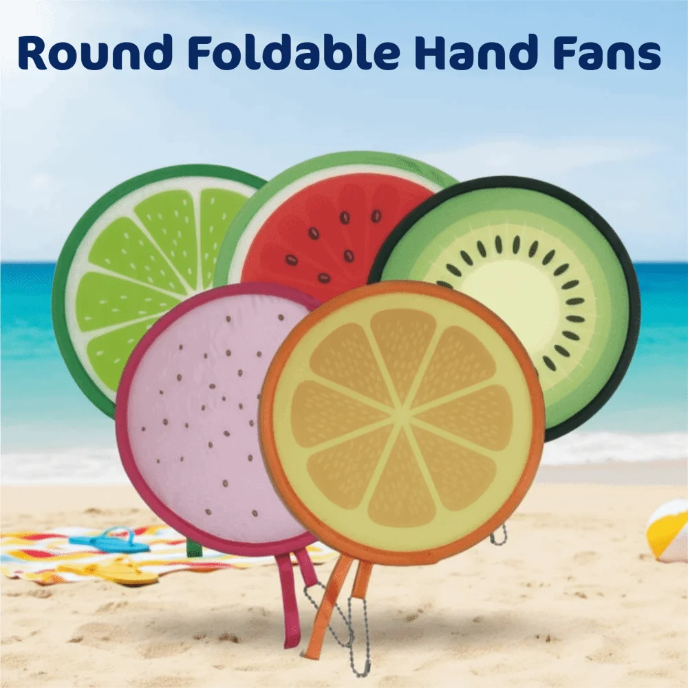 Round foldable hand fans featuring colorful fruit designs like lime, watermelon, and orange on a beach.