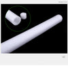 A white sponge stick is shown diagonally, with a magnified circle highlighting a smaller piece.