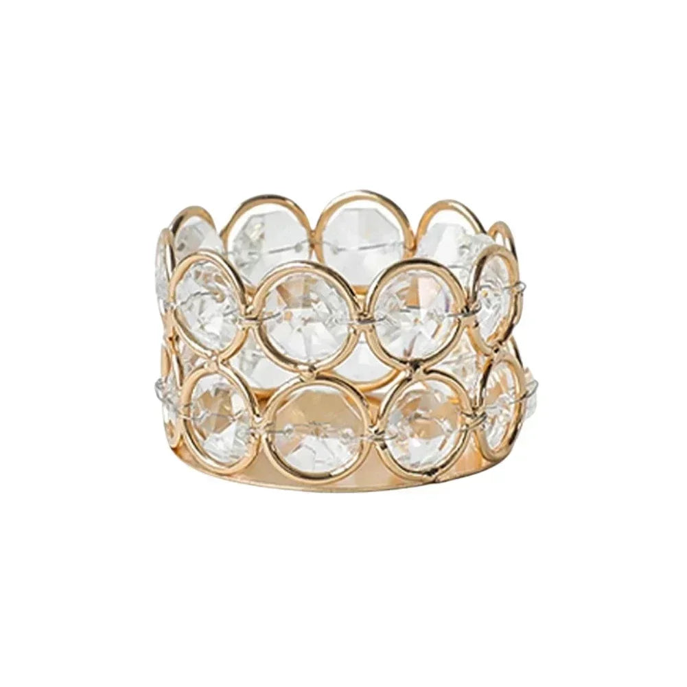 A gold-toned crystal lantern holder with a floral pattern, designed to hold tealight candles.