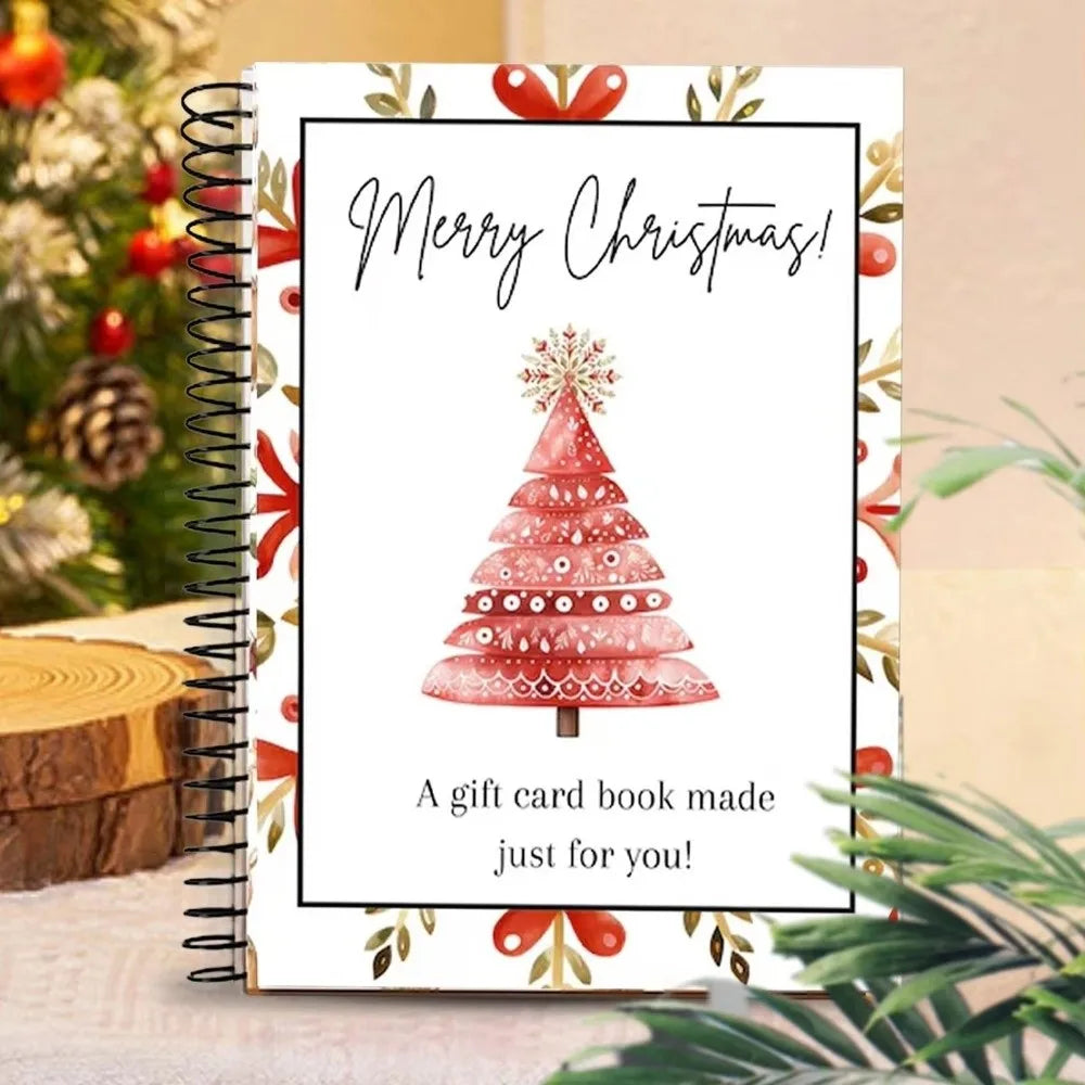 A spiral-bound gift card book featuring a pink Christmas tree design with a 'Merry Christmas' greeting.