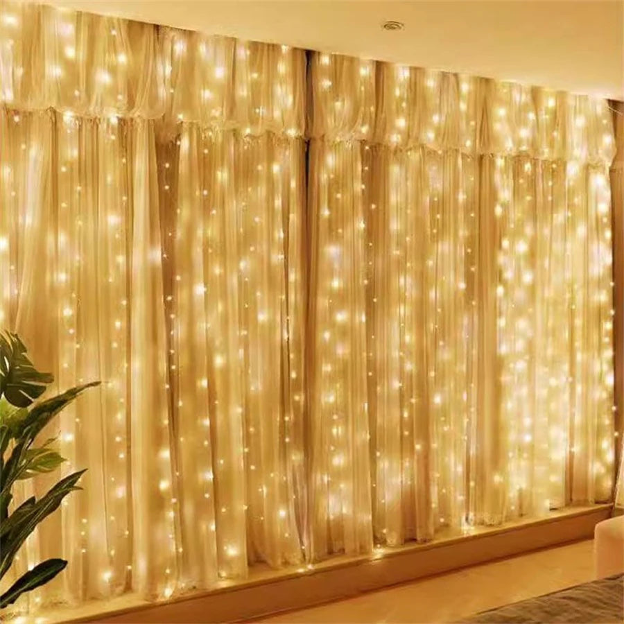 Golden sheer curtains illuminated by warm LED string lights