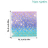 A square pack of 16 napkins featuring a watercolor pattern of blue and purple scales with gold accents.