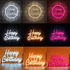 A collection of glowing neon wall signs wishing a happy birthday in various colors and styles.