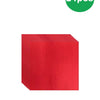 A stack of red paper tableware including dinner plates, napkins, cups, and cutlery.