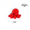Red octopus figurine with tentacles, a cute marine animal desk decoration.