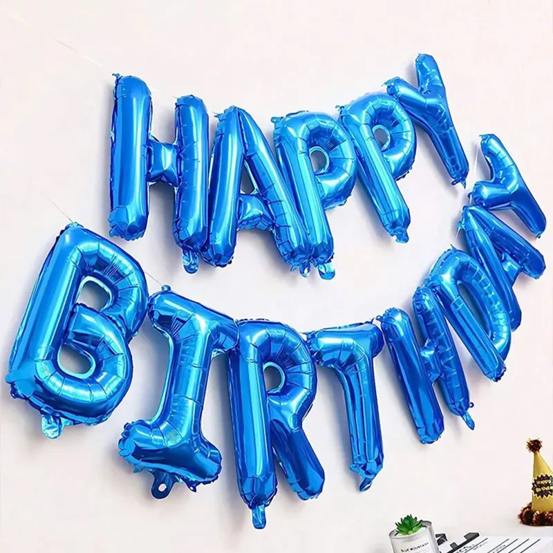A circular balloon decoration set spelling out HAPPY BIRTHDAY in blue foil balloons.