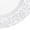 Silver embossed charger plates featuring ornate scrollwork design.
