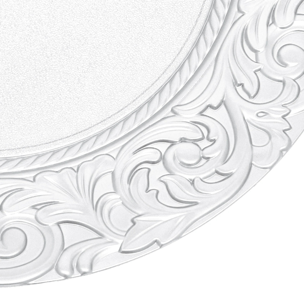 Silver embossed charger plates featuring ornate scrollwork design.