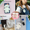 A collection of white plush teddy bear keychains and decorations including a mobile phone case, bag ornament, and keychain.